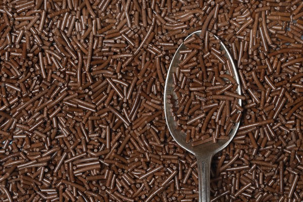 Chocolate sprinkles with teaspoon