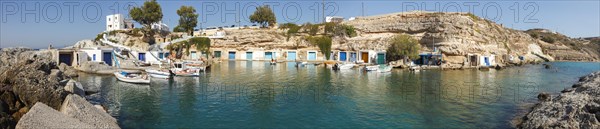 The Quaint Fishing Village with the Colorful Syrmata Boathouses in the small village of Mandraki on the island of Milos