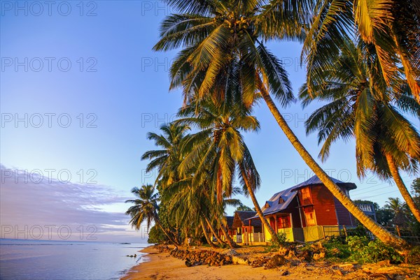 Bungalows at sunset on a beach on the Island Ile Sainte Marie