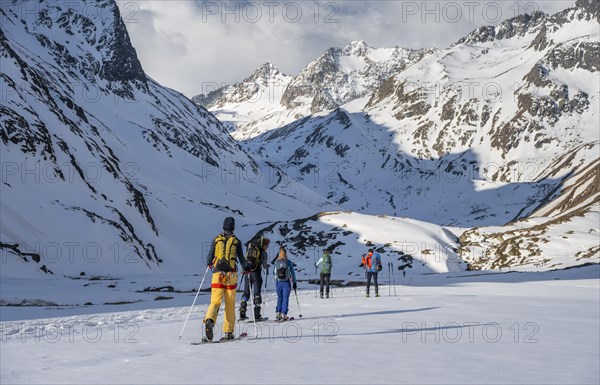 Ski tourers in winter in the mountains