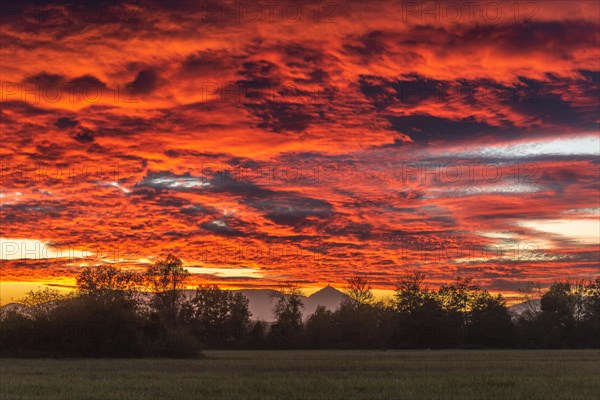 Beautiful glowing sky over the plain at sunset. Alsace