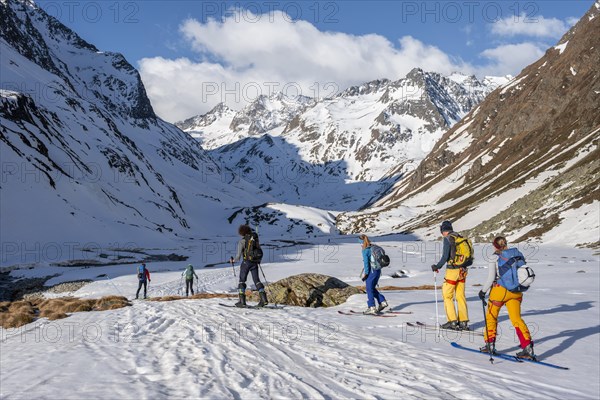 Ski tourers in winter in the mountains