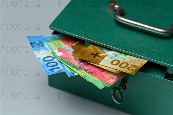 Cash box and Swiss banknotes