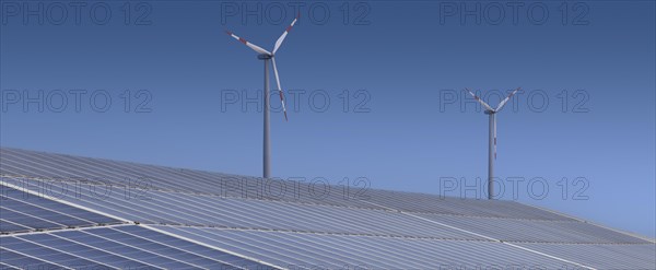 Solar plant with wind turbine in the background. Binsham