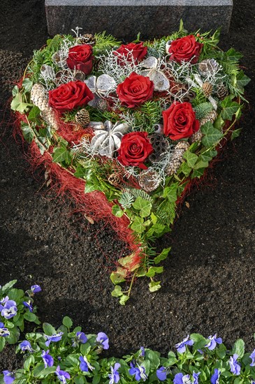 Grave with heart-shaped flower decoration