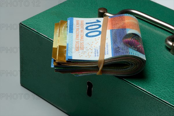 Cash box and Swiss banknotes