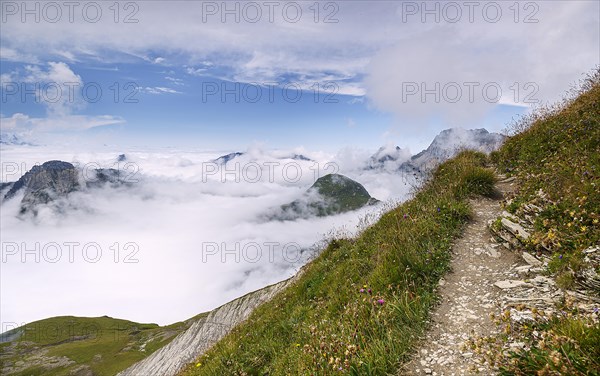 View from Gehrengrat over the fog-shrouded peaks of the Alps. Lech