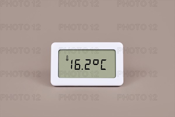 Digital thermometer showing cold room temperature of 16.7 degree Celsius