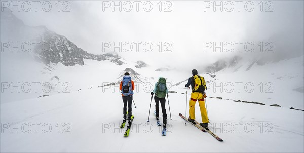 Three ski tourers climbing Sommerwandferner