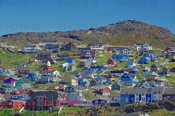 Colourful wooden houses on a mountainside