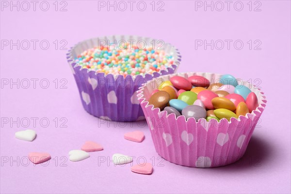 Chocolate lentils and love beads in paper moulds