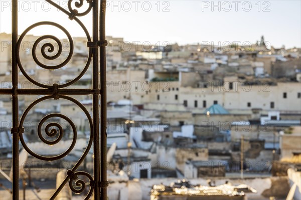 Fez medina seen through decorated in arabic style window