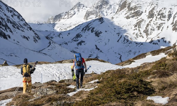 Ski tourers in winter in the mountains