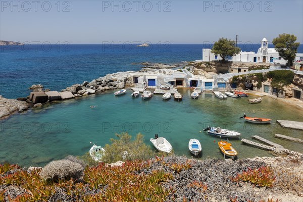 The Quaint Fishing Village with the Colorful Syrmata Boathouses in the small village of Mandraki on the island of Milos