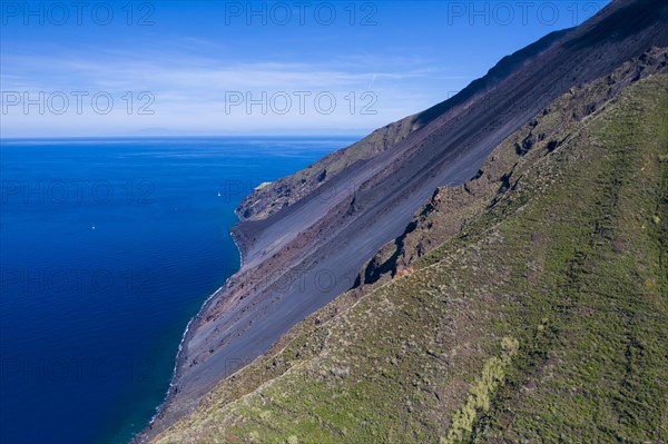 The stromboli vulcano erupting on the Sciara del Fuoco north west side