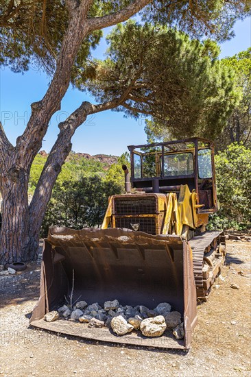 Old front loader at the entrance of the museum of the former ore mine