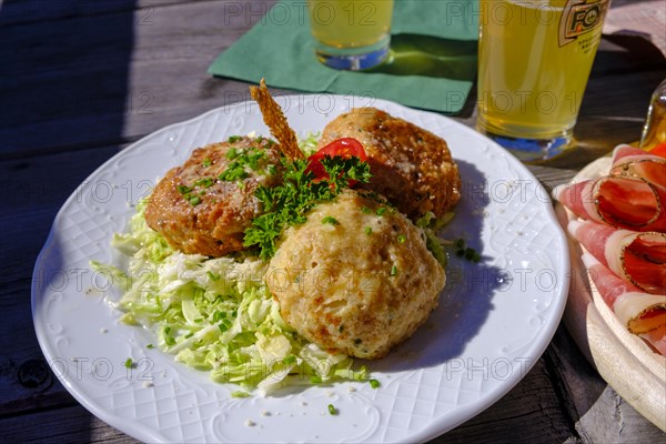 Kaspressknoedel on cabbage salad