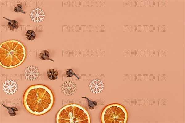 Seasonal winter flat lay with dried orange slices