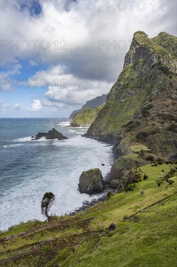 View of steep cliffs and mountains on the coast with sea