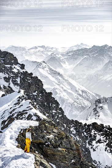 Mountaineer at the summit of the Sulzkogel