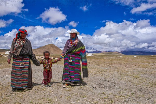 Traditional dressed women with a child