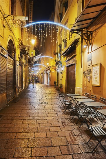 Street cafe in the pedestrian zone with Christmas lights