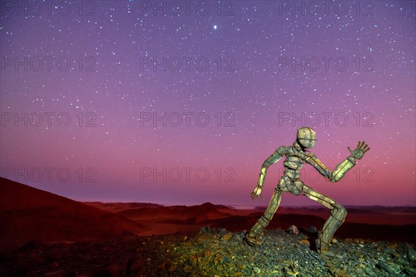 Stone man by the artist RENN at Skeleton Coast View Point in the Namib Desert under the starry sky