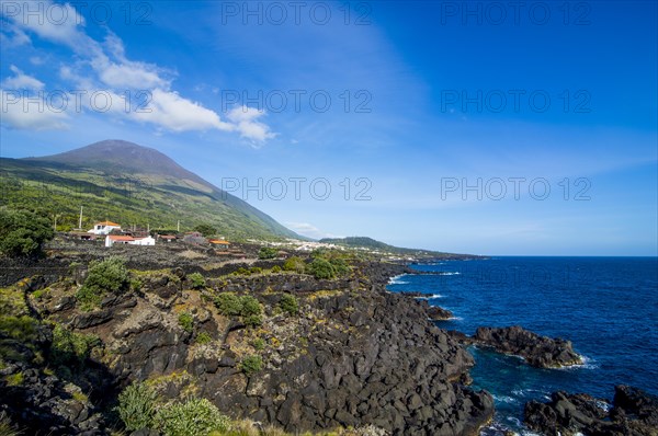 Rocky coastline below Ponta do Pico highest mountain of Portugal