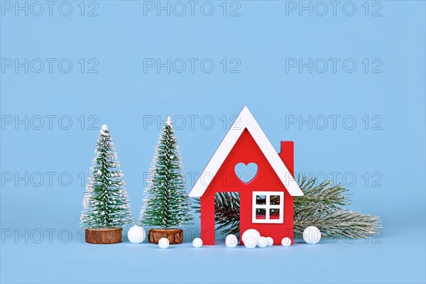 Winter decoration with small red house