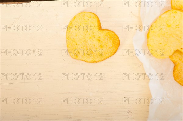 Fresh baked heart shaped shortbread valentine day cookies on a paper wrap