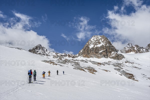 Group of ski tourers in winter in the mountains