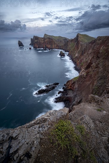 Red cliffs and rocks in the sea