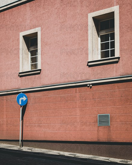 Empty street with blue road sign