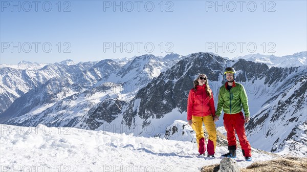 Two ski tourers at the summit