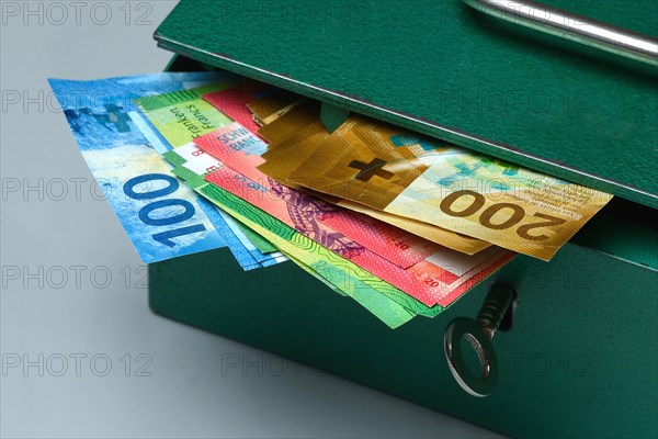 Cash box and Swiss banknotes