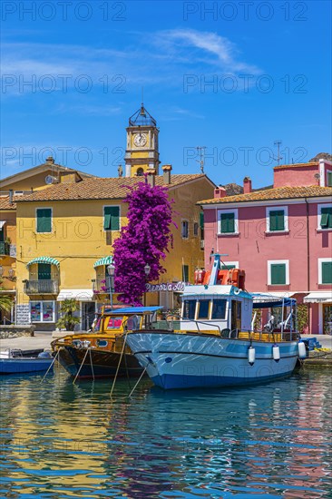 Boats anchor in the harbour of Porto Azzurro