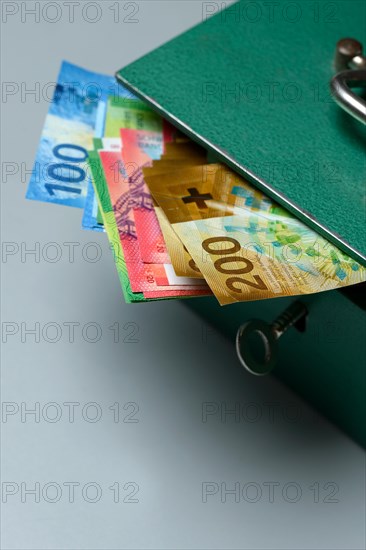 Cash box and Swiss banknotes