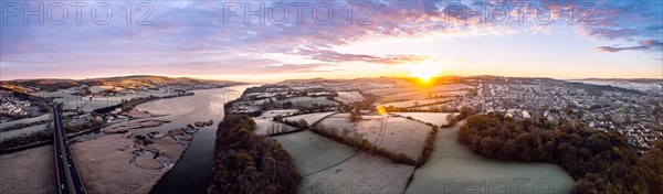 Sunrise over Bridge and Marshland of River Teign shrouded in frost from a drone
