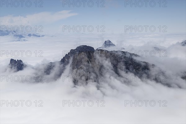 View from Gehrengrat over the fog-shrouded peaks of the Alps. Lech