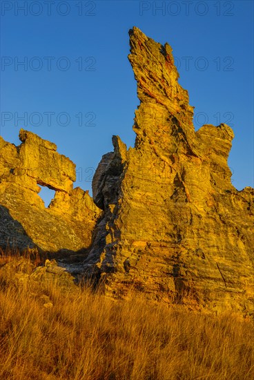 Savannah and huge rock formations at sunset in the Isalo National Park