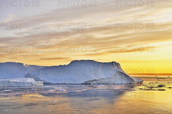 Gigantic icebergs in the evening light