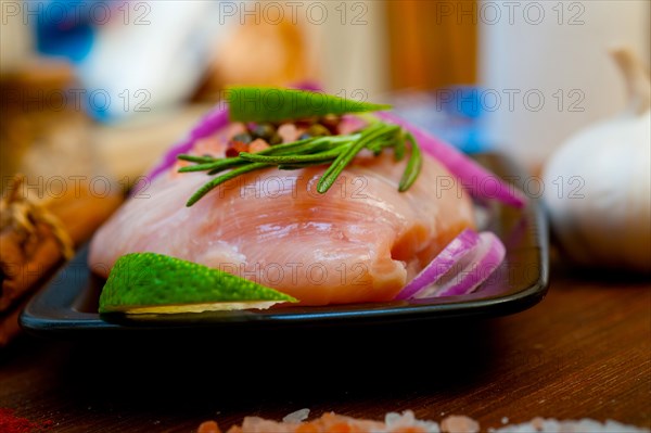 Fresh organic chicken breast with herbs and spices