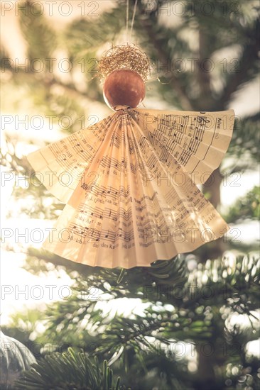 Handmade Christmas angel on christmas tree