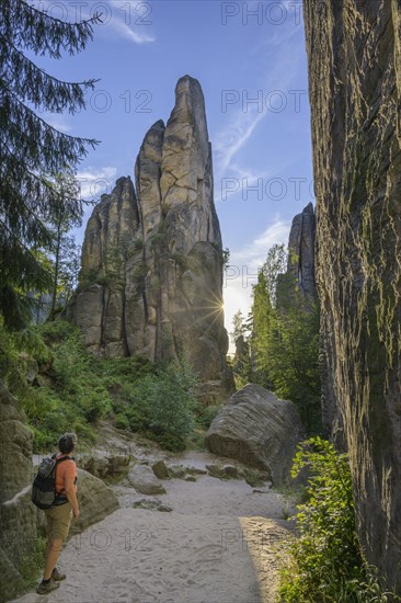 Woman looks at Prachovske rocks