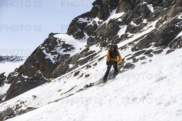 Splitboarders descending a steep slope