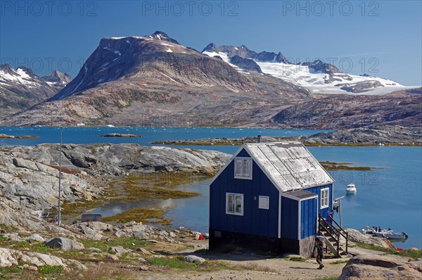 Simple cabin on a fjord