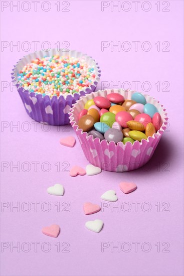 Chocolate lentils and love beads in paper moulds