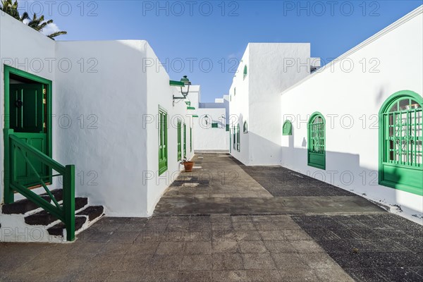 Picturesque white and green settlement called Pueblo Marinero designed by Cesar Manrique located in Costa Teguise