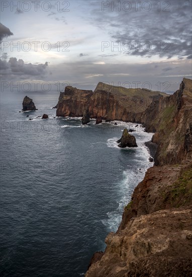 Red cliffs and rocks in the sea