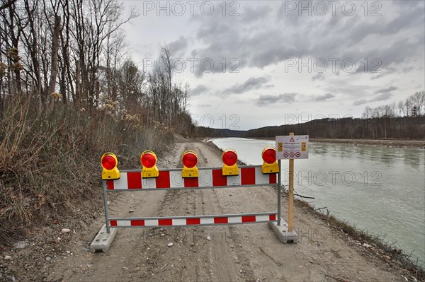 Closed construction site access road along a river